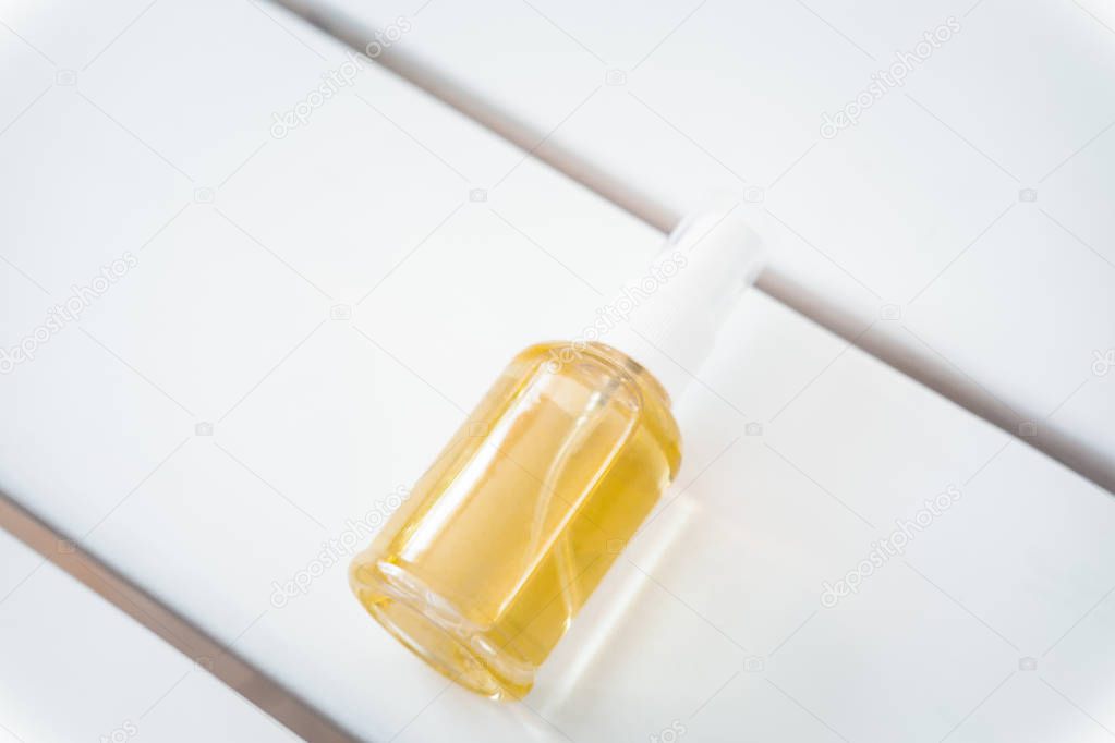 Spa face, hair, body oil bottle, cleanser, anti ageing treatment from above on white table. Beauty industry, branding mockup, package design template. 