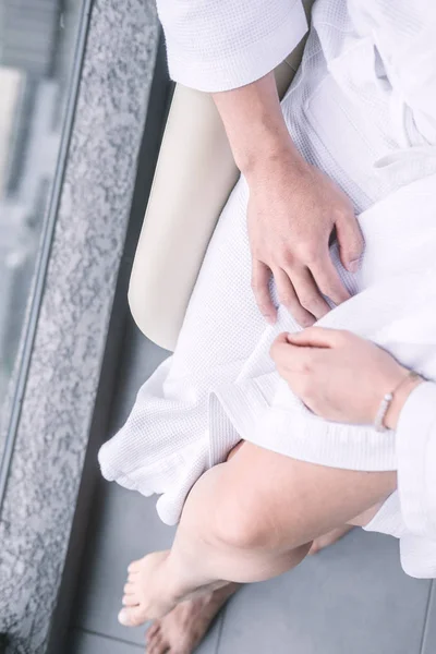 Woman Sitting Man Laps White Hotel Robes Touching Each Other — Stock Photo, Image