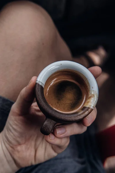 Overhead woman drinking espresso coffee