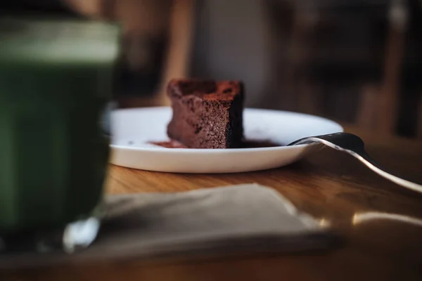 Slice of vegan chocolate brownie cake