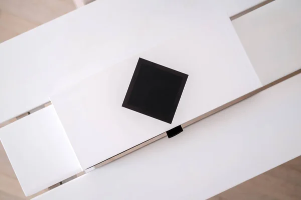 Beauty product packaging boxes in white and black