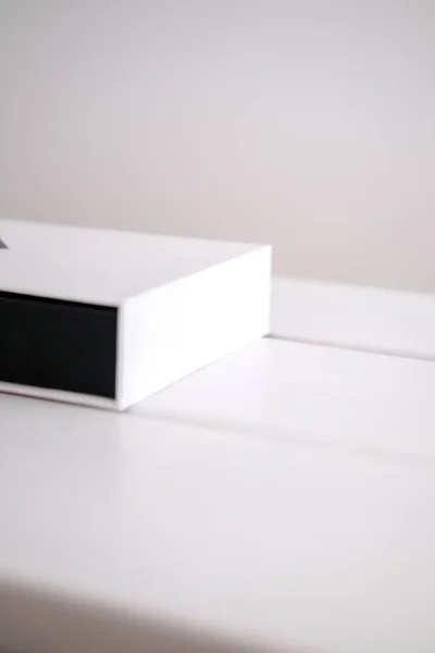 Beauty product packaging boxes in white and black