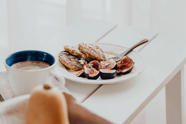 Pumpkin pancakes with figs on white wooden table — Stock Photo, Image