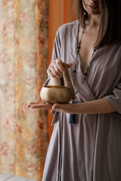 Woman holding in hands singing bowl — Stock Photo, Image