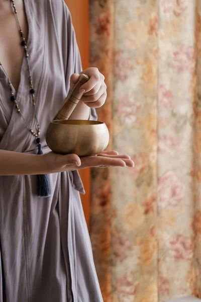 Woman holding in hands singing bowl — Stock Photo, Image