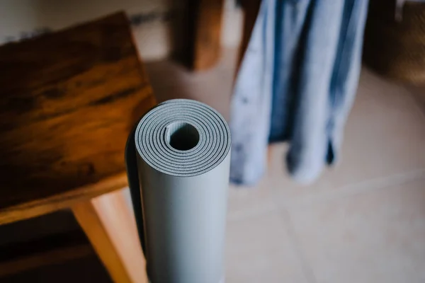 Pastel rolled yoga mat on white background — Stock Photo, Image