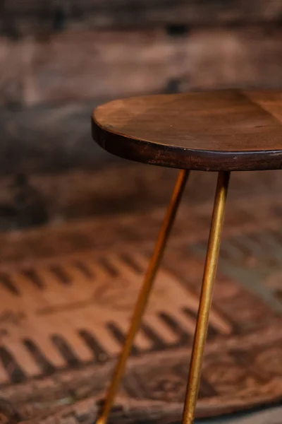 Rustic wood and bronze metal bar stool — Stock Photo, Image