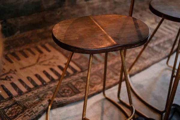 Rustic wood and bronze metal bar stool — Stock Photo, Image