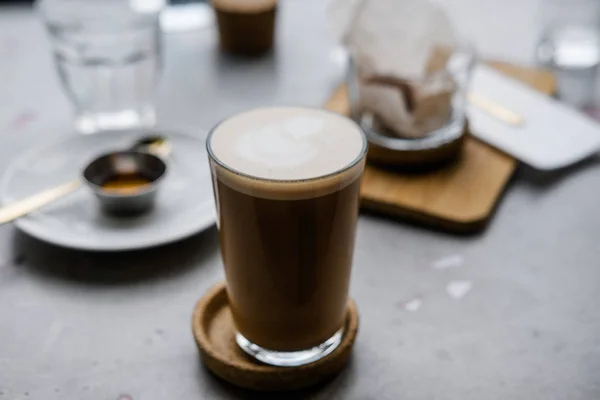 Masala chai latte on gray concrete table