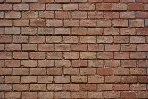 Red brick wall, old brickwork. Texture of old ceramic brick. Texture, background.