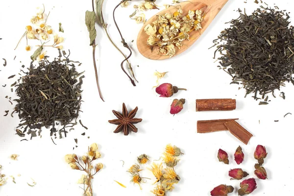 tea and herbs lie on a white background