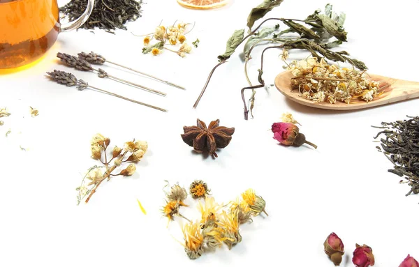 tea and herbs lie on a white background