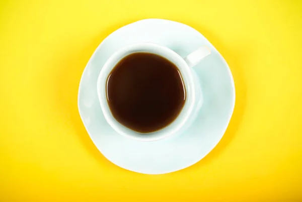 Coffee in beans, chocolate, almonds, nut and ears are on the table