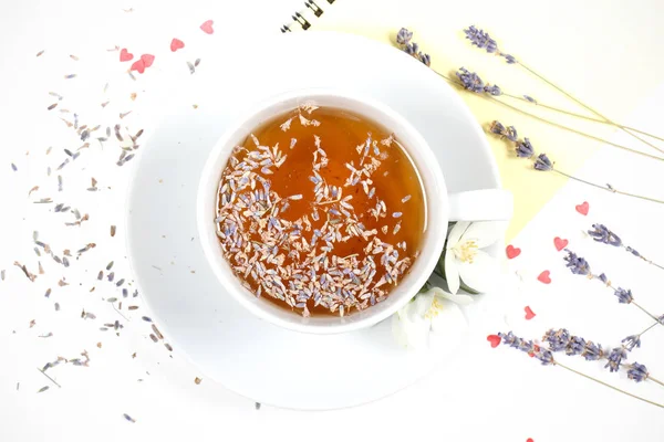 tea with lavender stands on white background