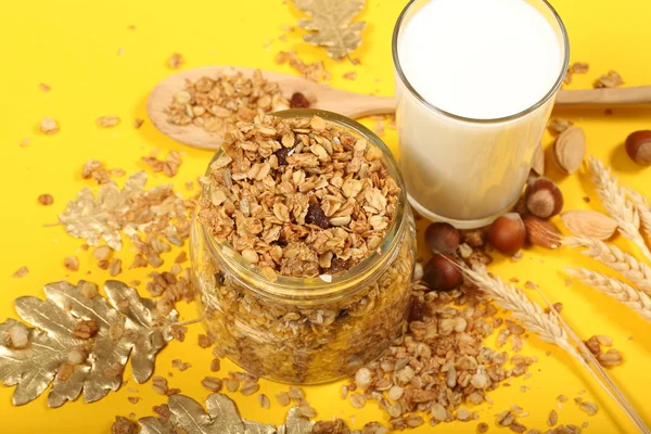 muesli nut with nuts and milk are on the table