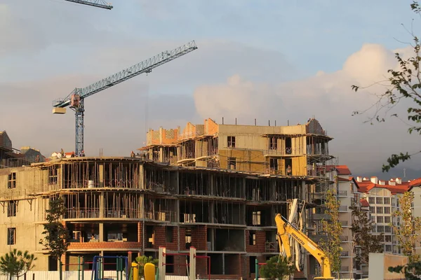 builders build a house on a Sunny day