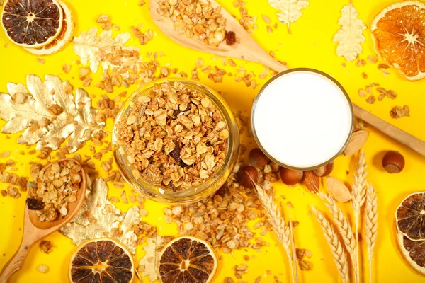 muesli flakes nut with nuts and milk are on the table