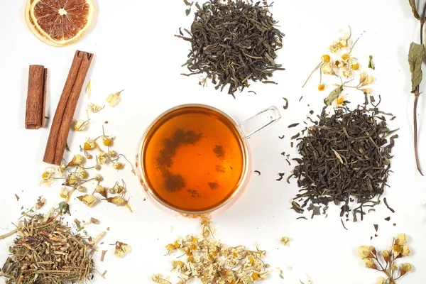 tea and dry grass lie on a white background