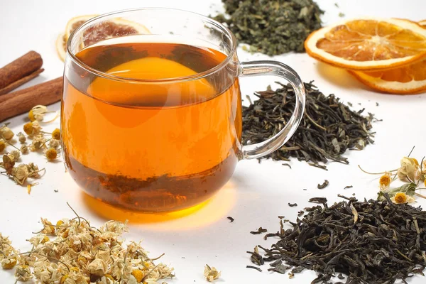 tea and dry grass lie on a white background