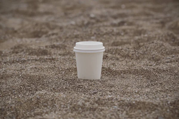 white paper Cup with coffee in nature