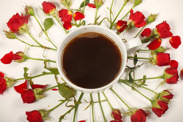 bright roses and coffee stands on the table