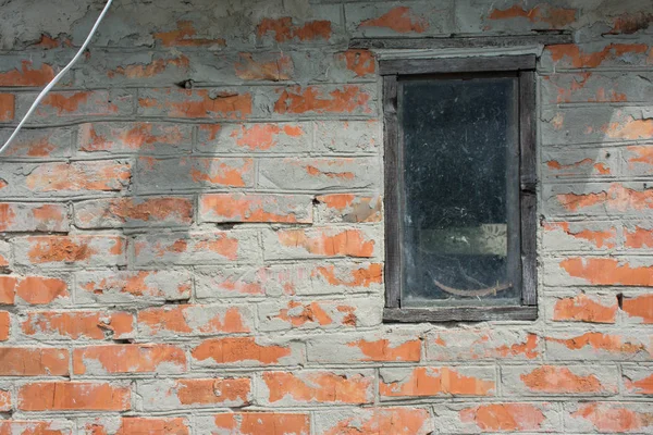 Orange brick wall with window