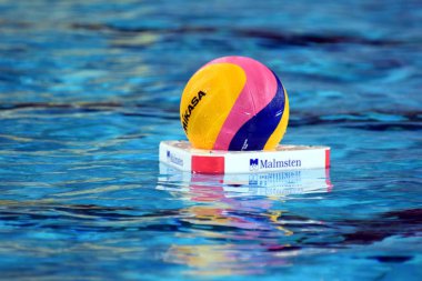 BUDAPEST, HUNGARY - JUL 20, 2017: Waterpolo ball in the swimming pool. FINA Waterpolo World Championship was held in Alfred Hajos Swimming Centre in 2017. clipart