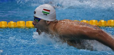Budapest, Hungary - Jul 25, 2017. Competitive swimmer KENDERESI Tamas (HUN) swimming butterfly. FINA Swimming World Championship Preliminary Heats in Duna Arena. clipart