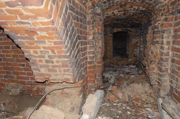 Old haunted basement in an abandoned house. bricked walls in the basement. — Stock Image Old haunted basement in an abandoned house. bricked walls in the basement. Stock Photo