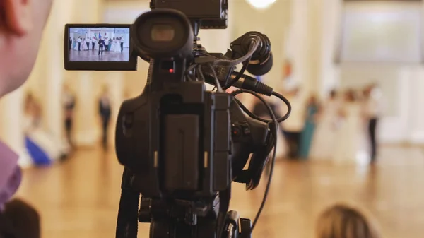 Videographer shoots people in vintage ball costumes at the historical ball Royalty Free Stock Photos