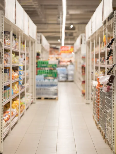 Picture blurred for background abstract. Blurred shelves in the supermarket — Stock Photo, Image