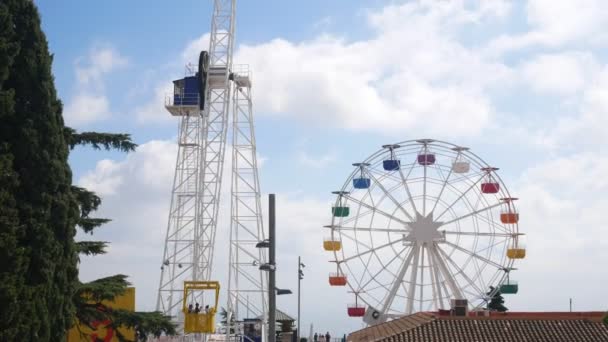 Tibidabo observation wheel against blue sky. Amusement park — Stock Video