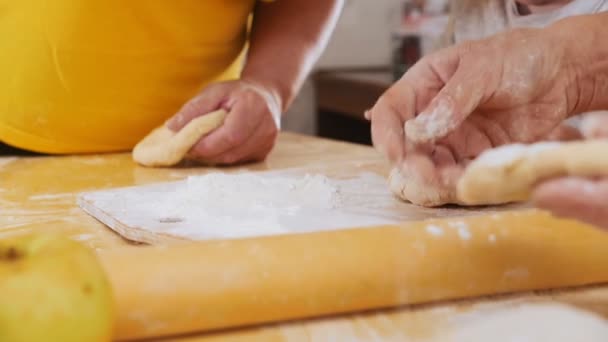Family making little pies. Hands in focus. Slow motion — Stock Video