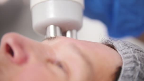 Anti-aging procedure. Working with special instrument. Face smoothing. Close up — Stock Video