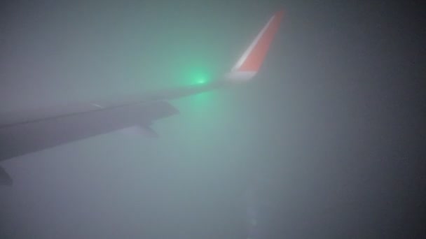Travel concept. View from airplane window. Bad foggy weather. — Stock Video