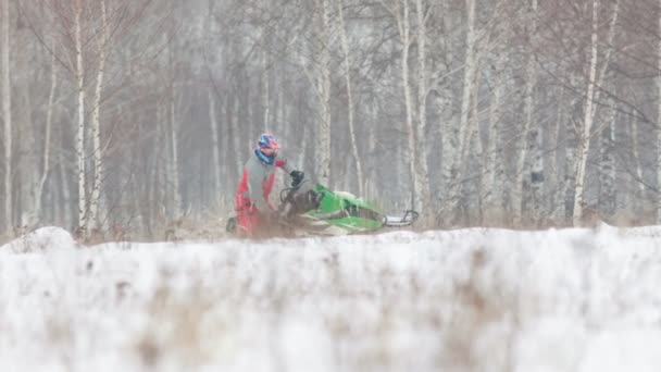 Winter Man Bright Clothes Driving Green Snowmobile Wide Shot — Stock Video