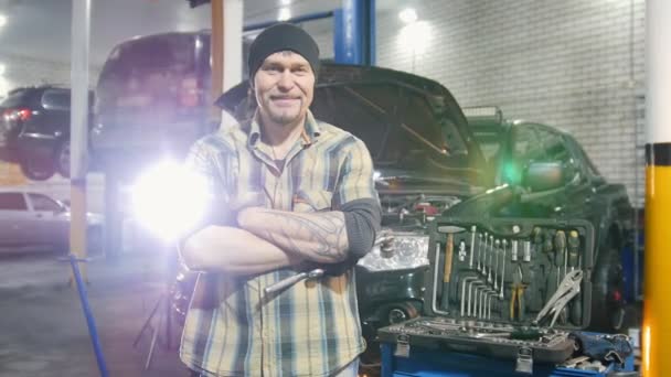 Car Service Brutal Mechanic Man Standing Car Smiles Removes Working — Stock Video