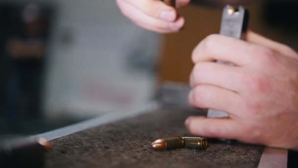 Shooting gallery. Charging the cartridge with a bullets — Stock Video