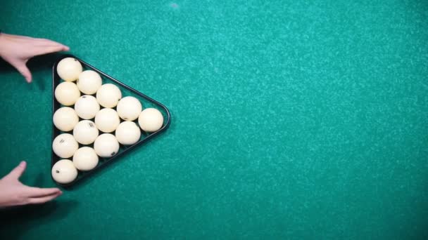 Forming a triangle of white billiards balls and breaking down the form with a hit — Stock Video