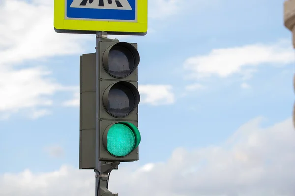 Green traffic light in the city street