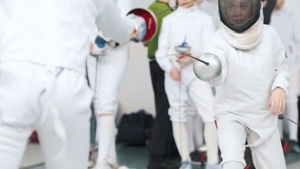 27 MARCH 2019. KAZAN, RUSSIA: Little girls in white clothes fighting on a fencing tournament — Stock Video