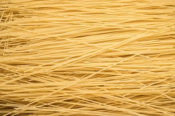 Pasta de espagueti en cantidades - textura de macarrones — Foto de Stock