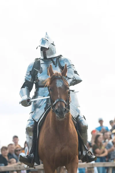 BULGAR, RUSSIA 11-08-2019: Knight riding a brown horse holding a sword — Stock Photo, Image