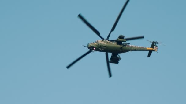 A military green camouflage helicopter flying in the sky — Stock Video