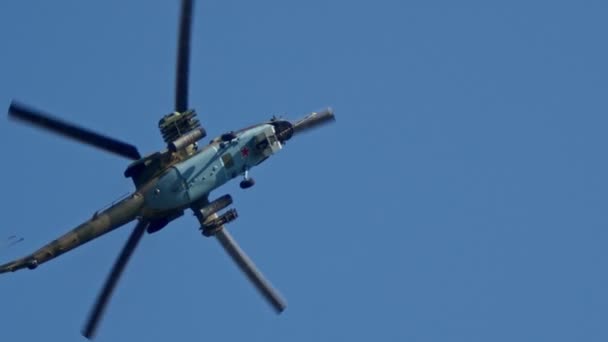 29 AUGUST 2019 MOSCOW, RUSSIA: A light blue camouflage military helicopter with small red star flying in the clear sky — Stock Video
