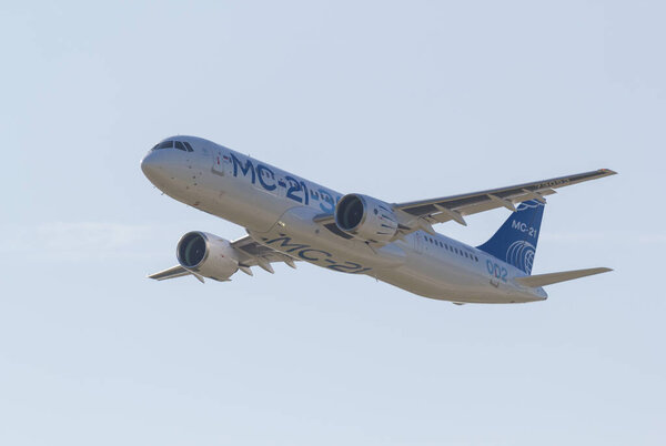 30 AUGUST 2019 MOSCOW, RUSSIA: A passenger plane flying in the sky - AIRBUS MC-21