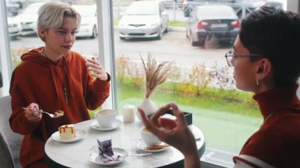 Girl is carefully listening to another girl — Stock Video