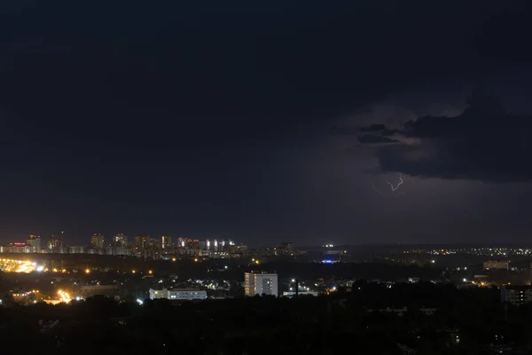 Lightning flashes in the sky above the city