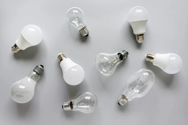 Glowing LED lamp including incandescent lamps on a white background.