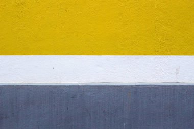 Gri, beyaz ve sarı duvar arka plan boyalı